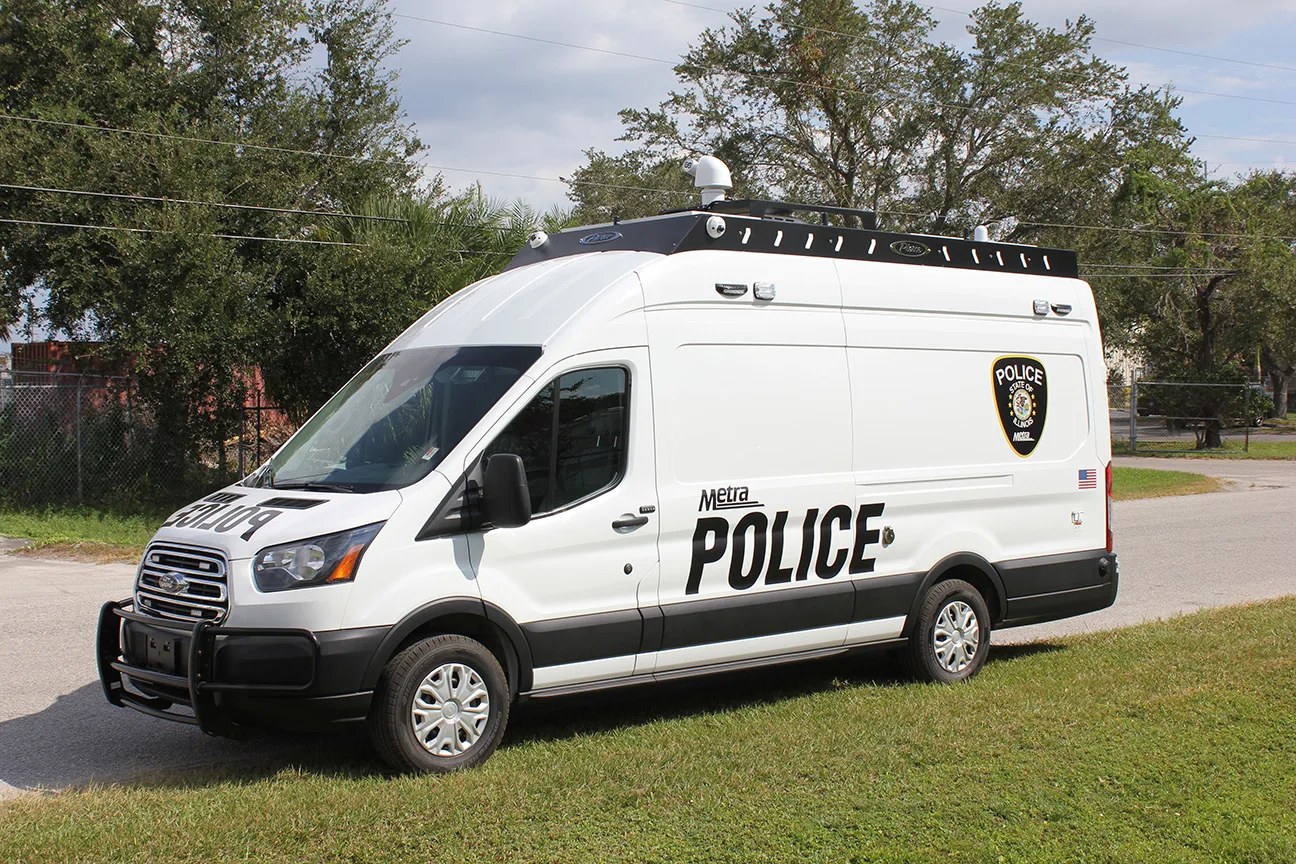 Frontline Communications CRU-22 Mobile Command vehicle parked outside on the street on a cloudy day.
