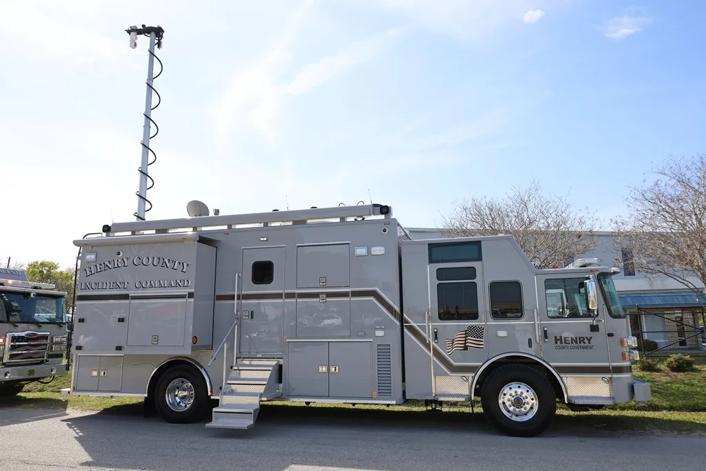 C-35X Mid-Size Command vehicle parked outside of the Frontline Communications building on a sunny day.