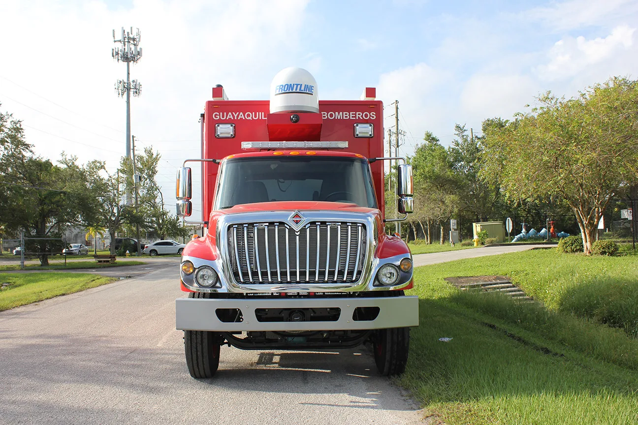 Frontline Communications C-30 Incident Command vehicle parked outside on the street on a sunny day.