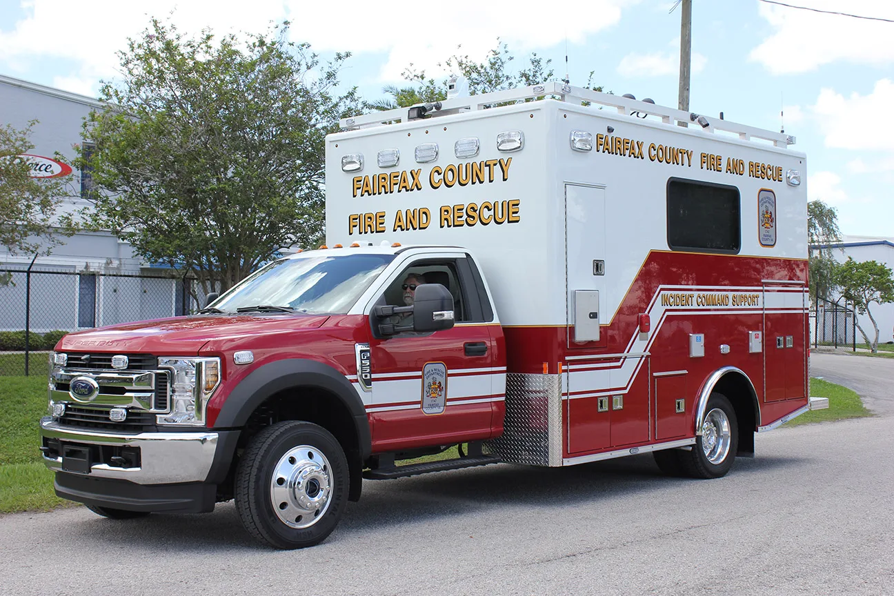 C-25 Small Mobile Command vehicle parked outside near the Frontline Communications building.