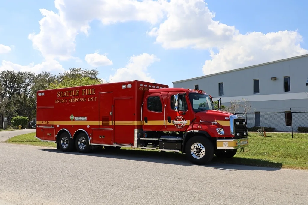 Seattle Fire and City Light CO2 Specialty vehicle parked outside of the Frontline Communications building on a sunny day.