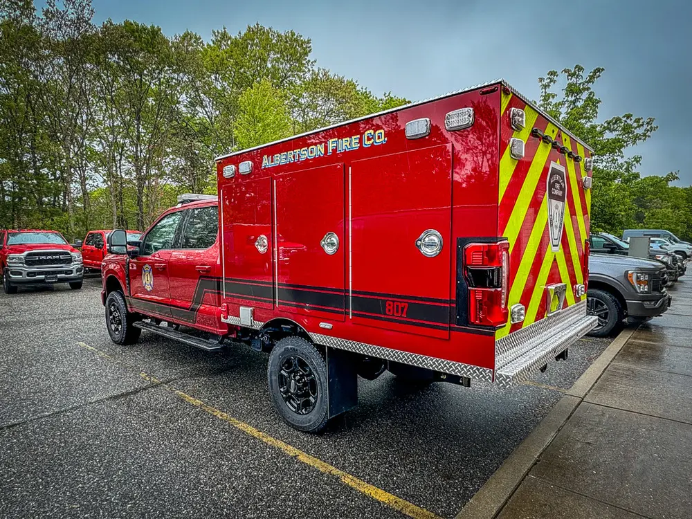Rear driver-side three-quarter view with chevron back panel.