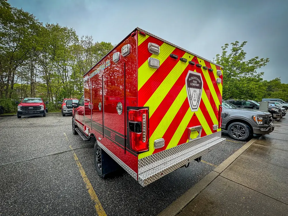 Rear passenger-side three-quarter view with taillight and chevrons.