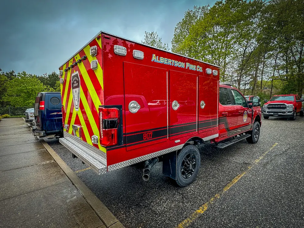 Rear driver-side angle showing rear door frame and side panel.