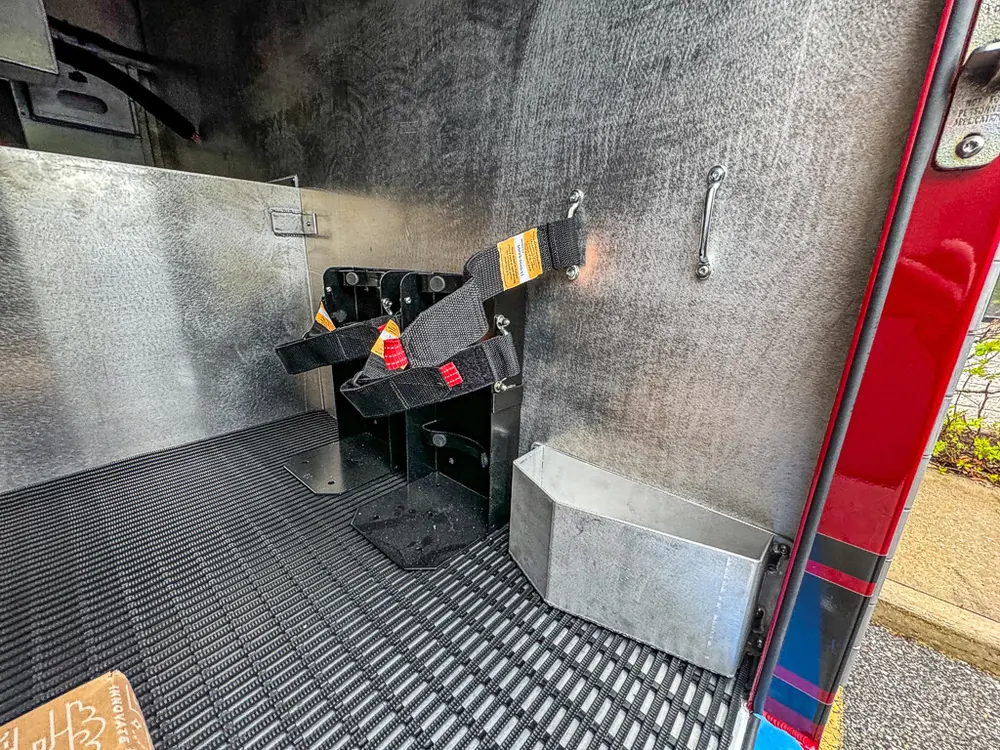 Compartment floor close-up with mounting brackets and fixtures.