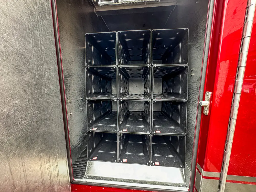 Close-up of charging dock rack inside compartment.