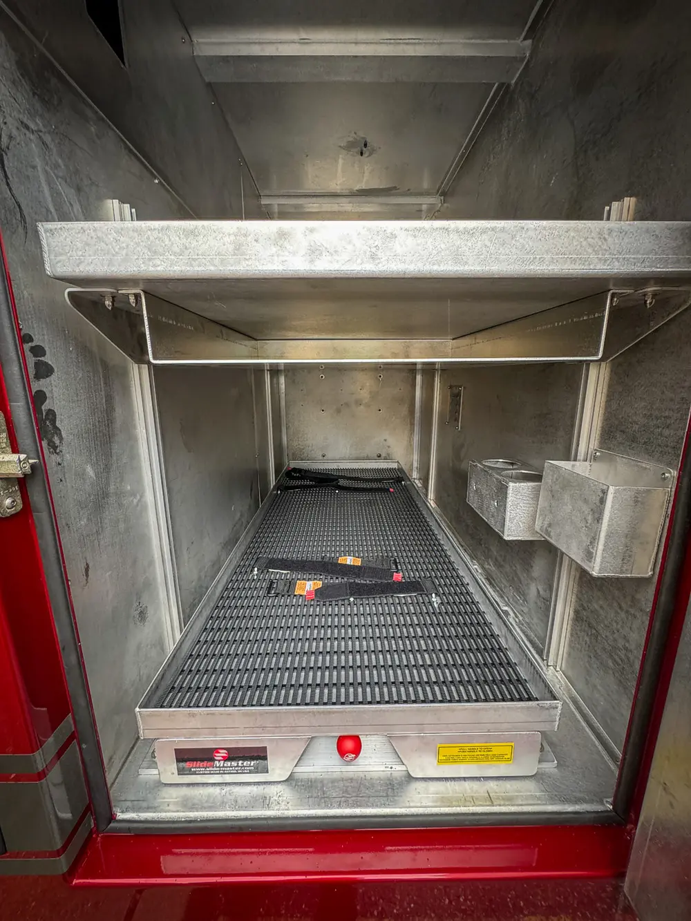 Open lower compartment with long shelf and side cubby.