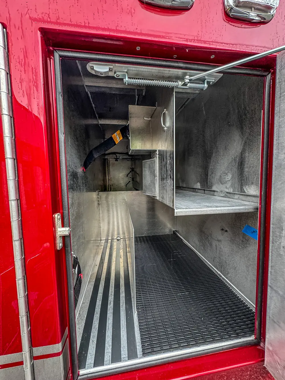 Deep compartment bay with side shelf and floor channels.