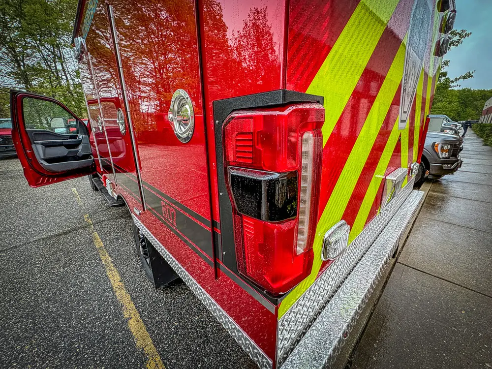 Opposite rear corner taillight assembly close-up.