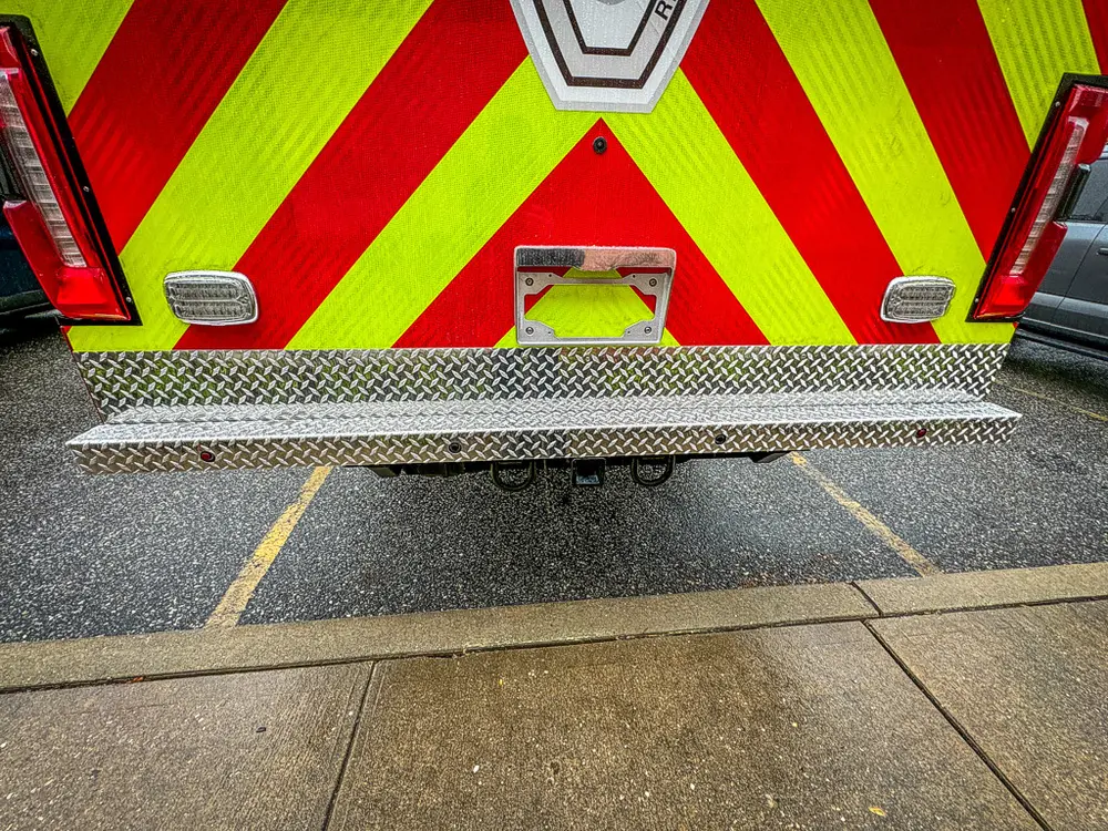 Rear step bumper and lower chevron panel close-up.