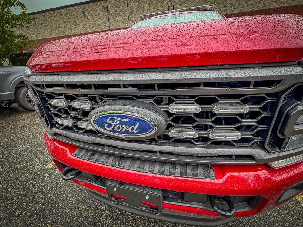 Front grille close-up with Ford emblem and lower light bar.