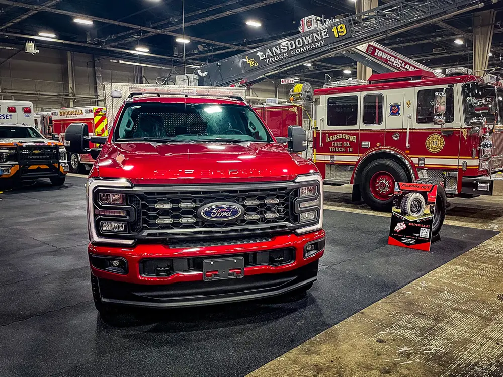 Head-on front view with grille and bumper lights.
