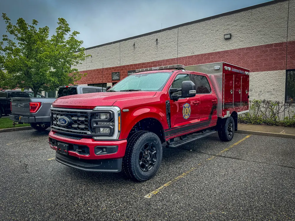 Front passenger-side angle outdoors showing cab and front wheel.