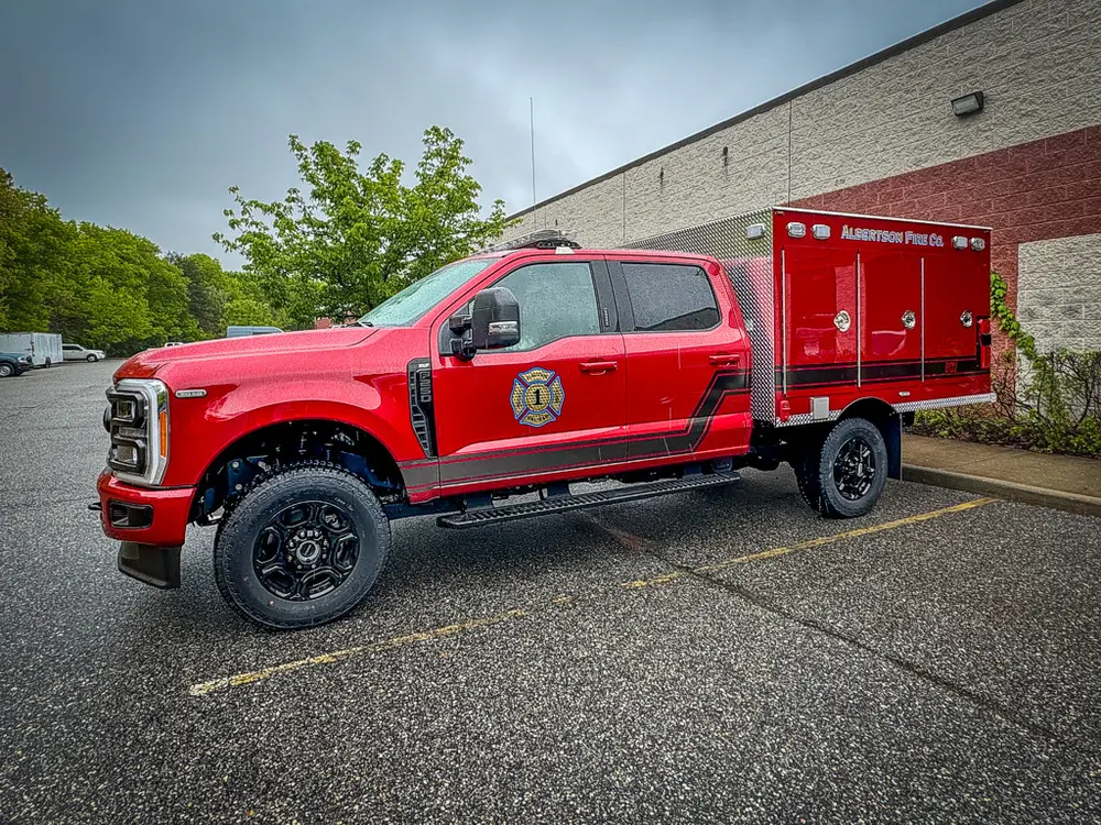 Passenger-side profile with enclosed rear body compartments.