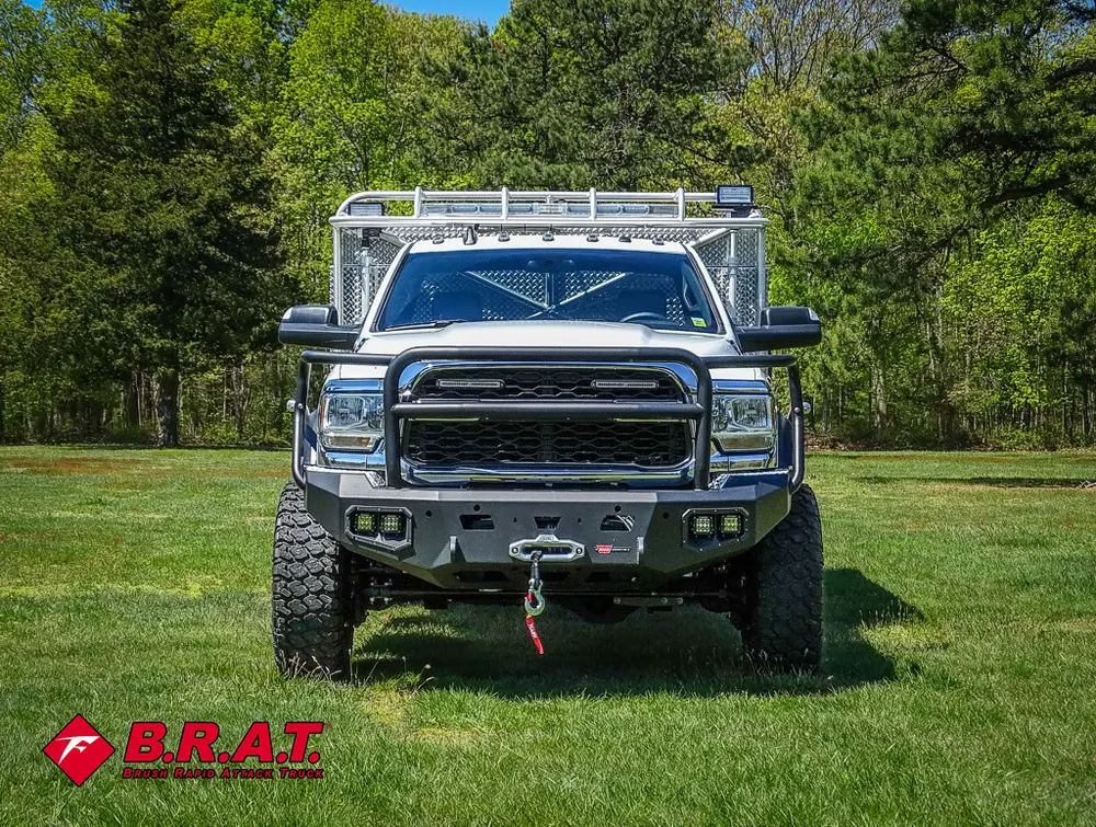Head-on front view with grille guard and bumper lights.