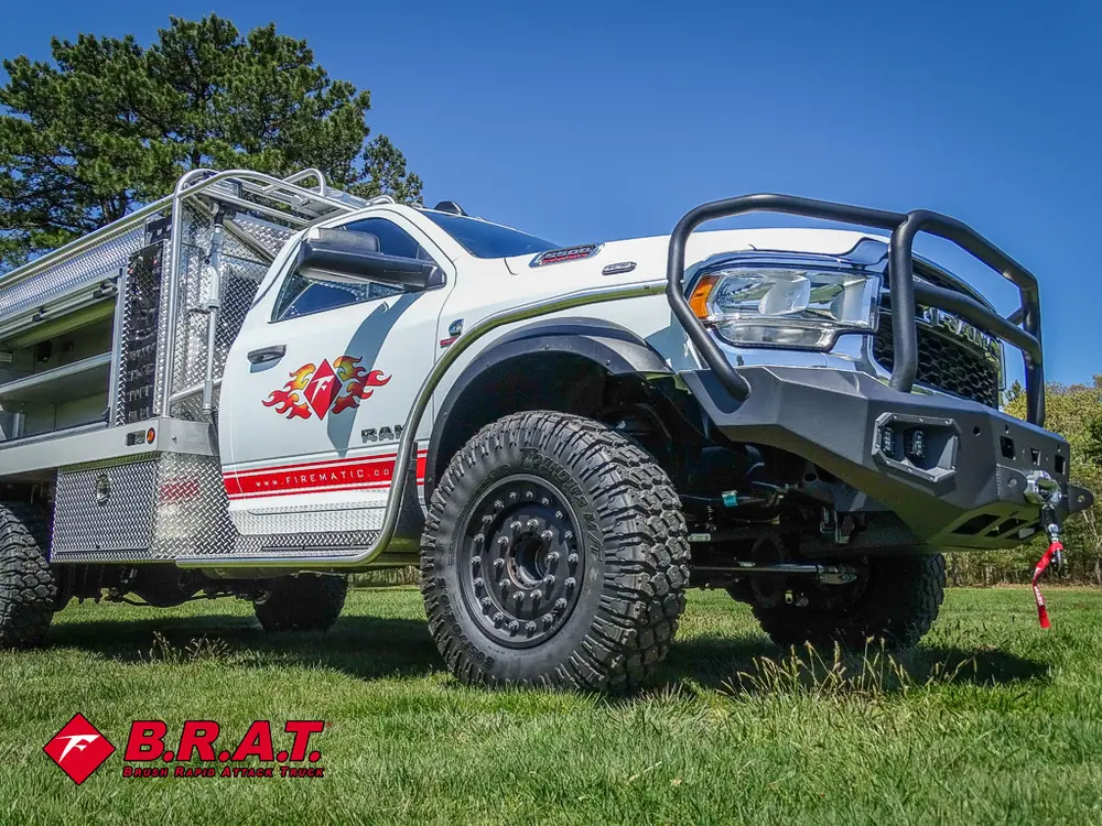Front corner view highlighting brush guard and winch bumper.