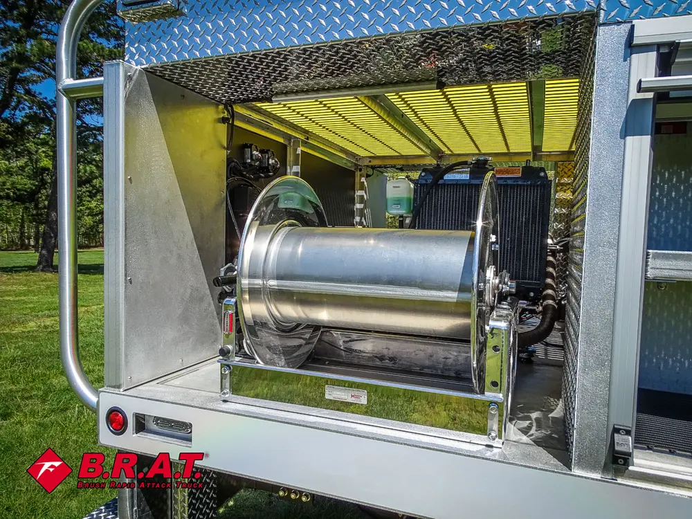 Rear side hose reel drum stored in side compartment.