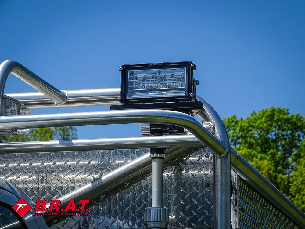 Roof rack top light mounted above side rail.