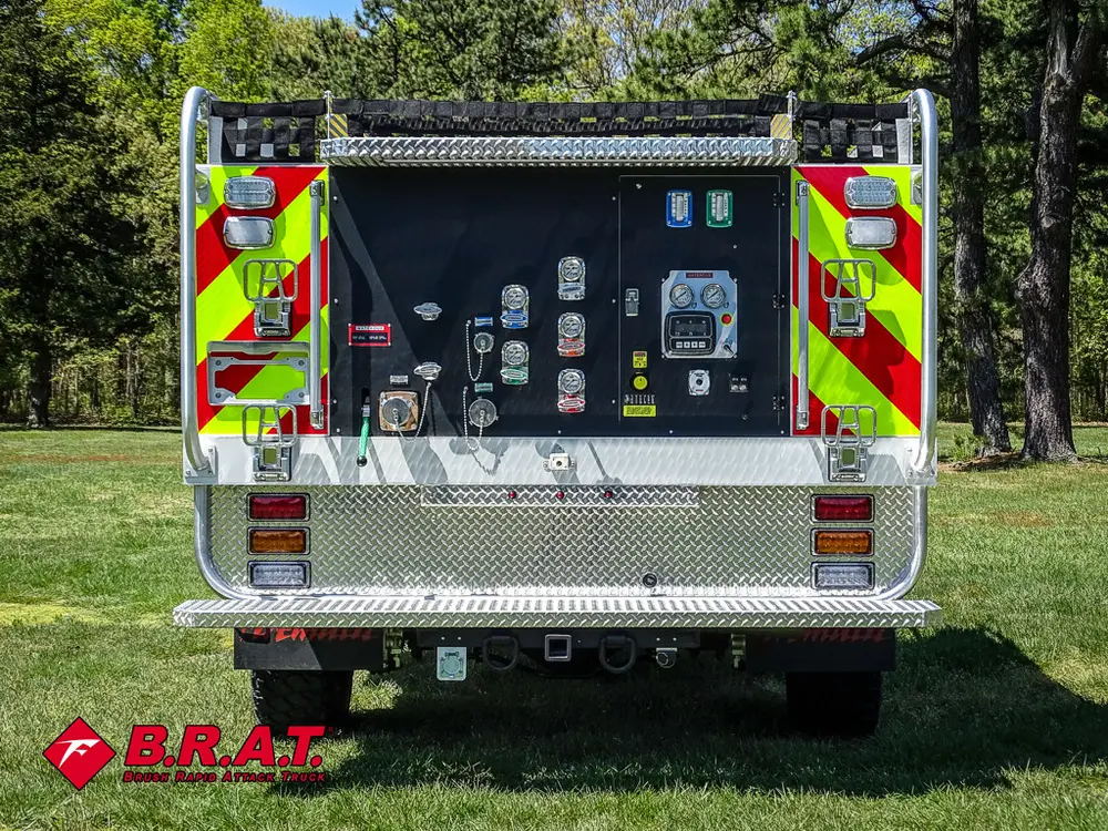 Straight rear view with open pump panel and rear lights.