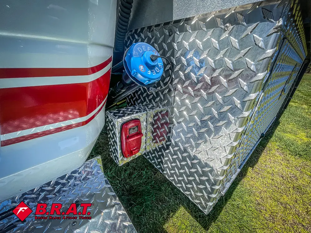 Rear side corner with blue utility cap and taillight.