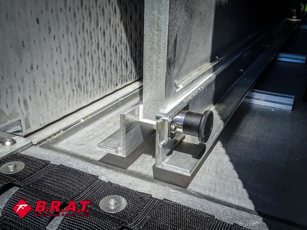 Open side door hinge and latch mechanism close-up.