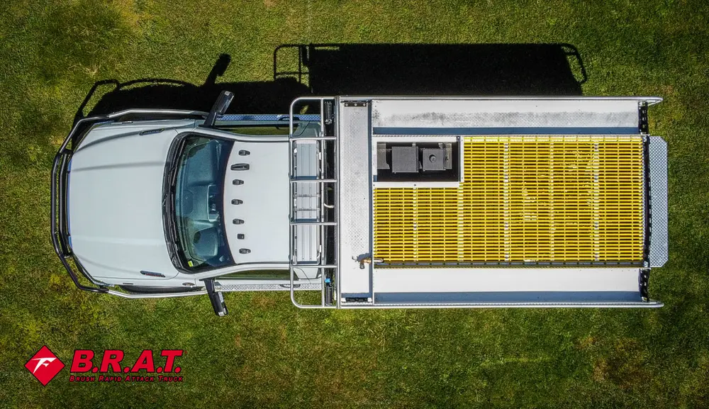 Top-down view of yellow grated rear deck and roof section.
