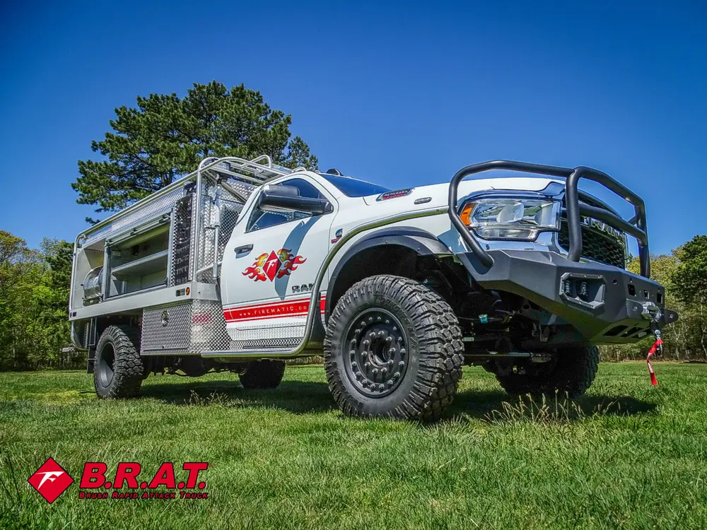 Front driver-side angle with black brush guard and raised suspension.
