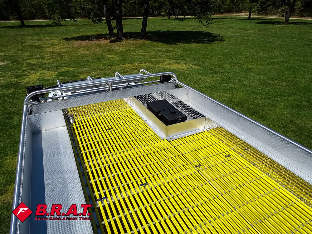 Close-up of yellow rear deck grate with hatch opening.
