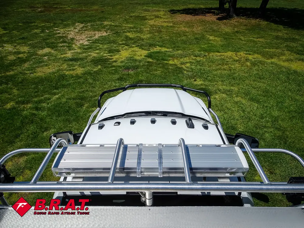 Forward-facing view over cab roof and roof rack rails.