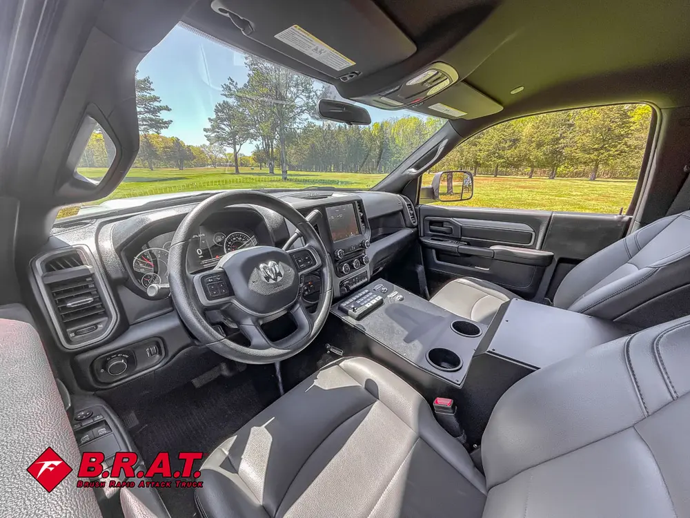 Driver cabin interior with steering wheel and dashboard controls.
