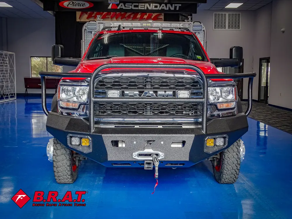 Head-on front view with grille guard and bumper-mounted winch.