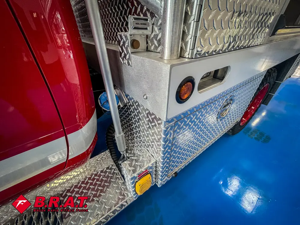 Rear side corner close-up showing lights and mesh panel.