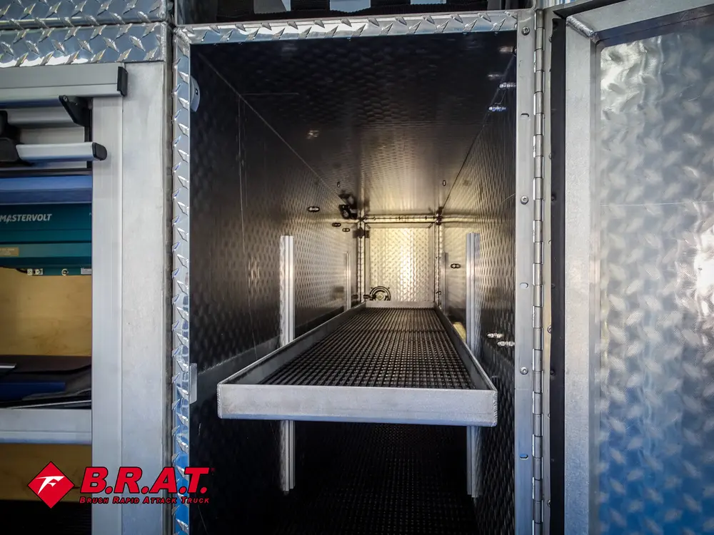 Tall open compartment with shelf and black mat floor.