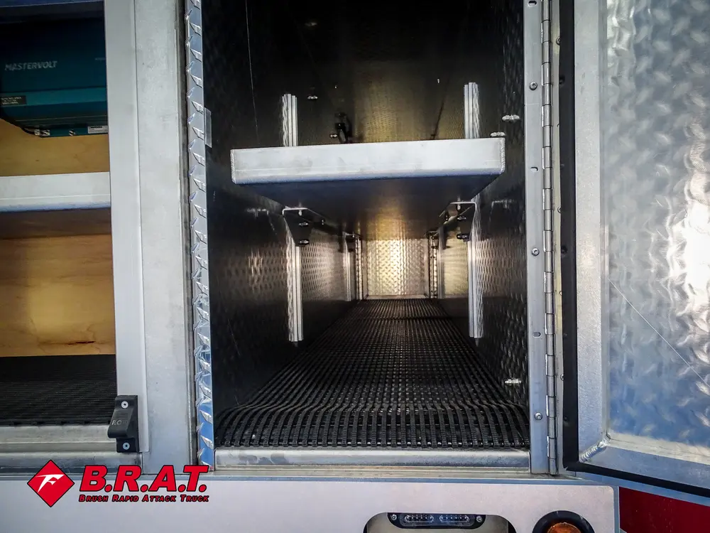 Open vertical storage bay with upper shelf and side rails.