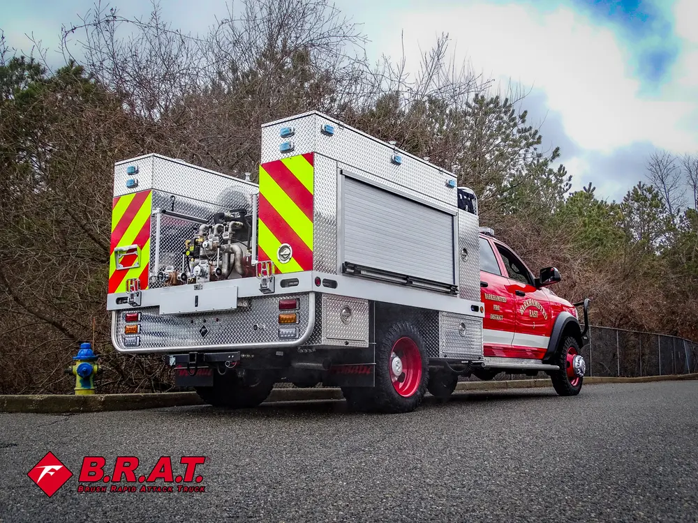 Rear passenger-side angle showing closed roll-up compartment doors.