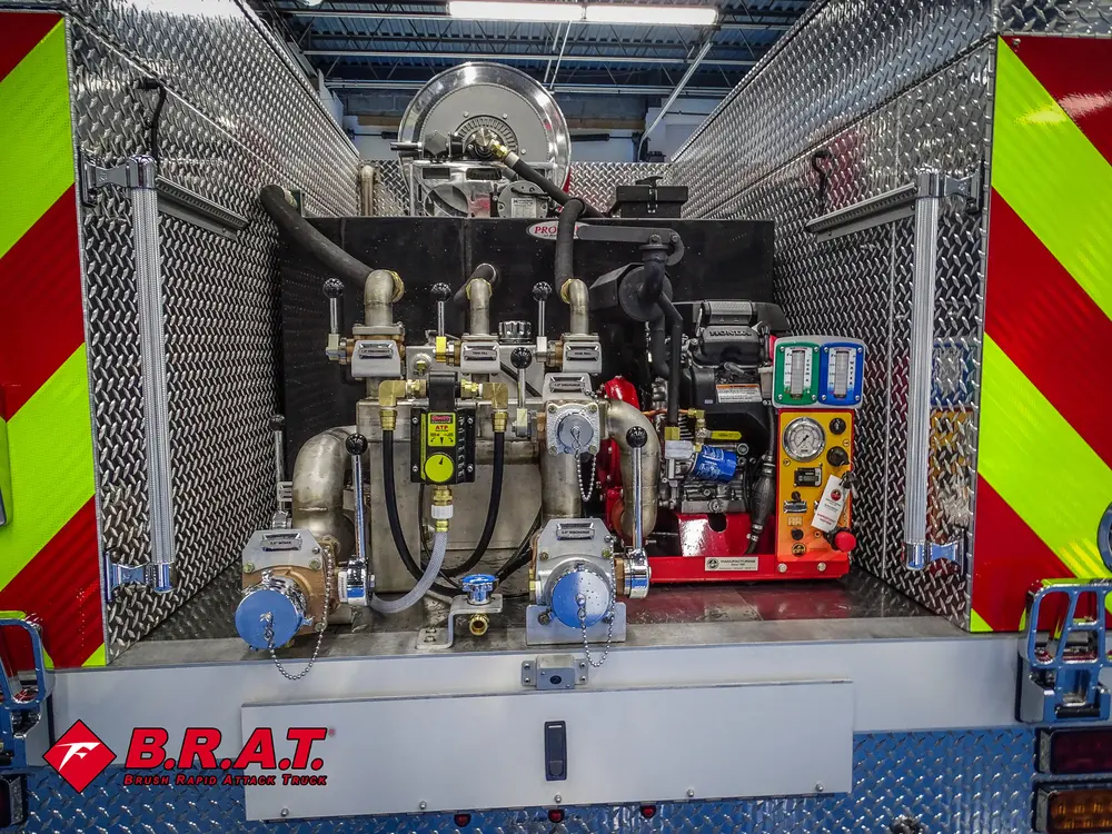 Rear pump bay wide view with manifolds, valves, and gauges.