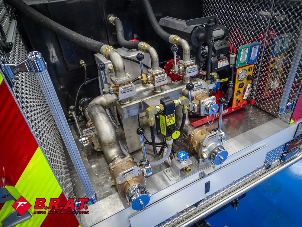 Right side of pump system with polished pipes and controls.