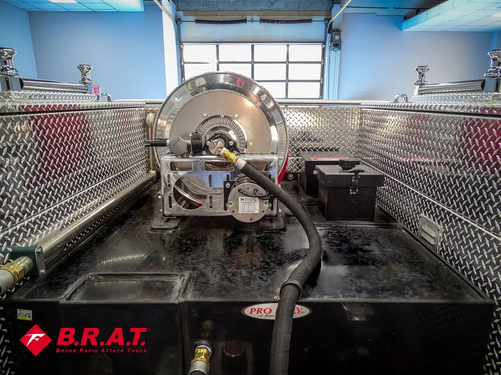 Top rear deck showing hose reel and equipment tray.