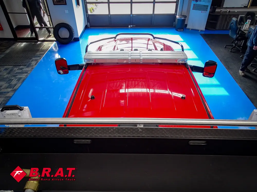 Rear deck with open hatch lid near top of cab.