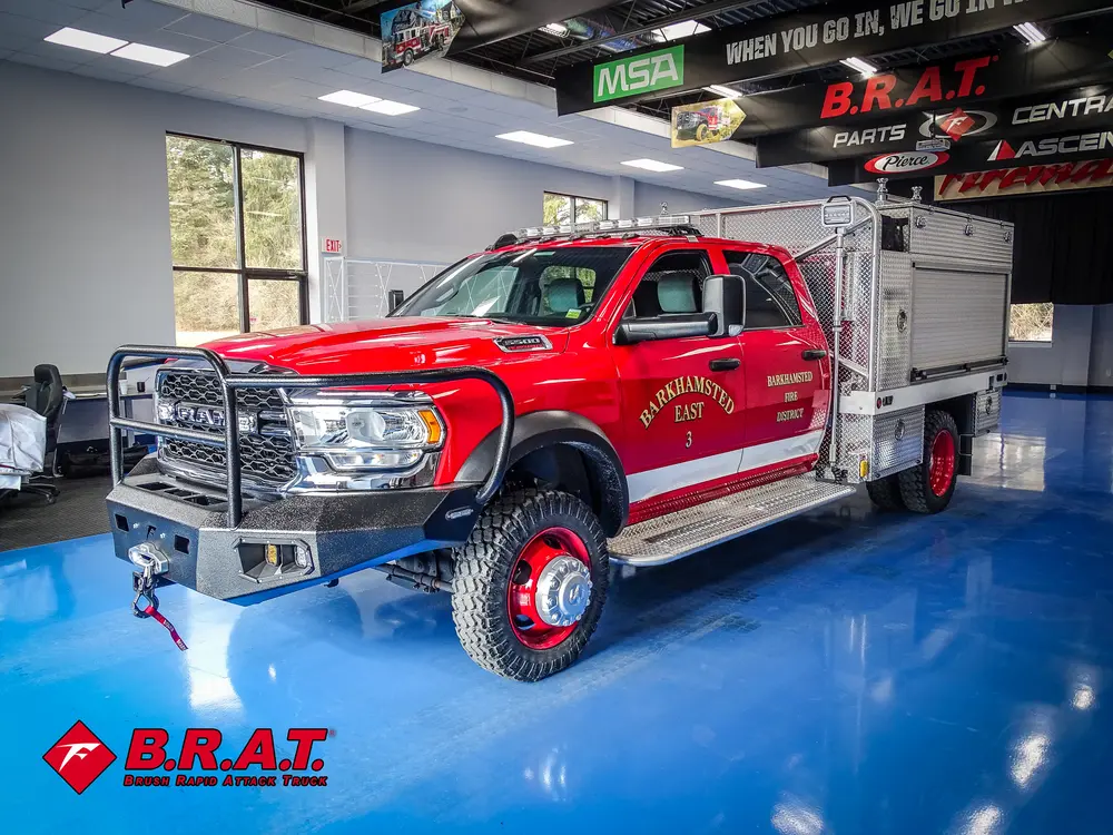 Passenger-side front three-quarter view inside garage bay.