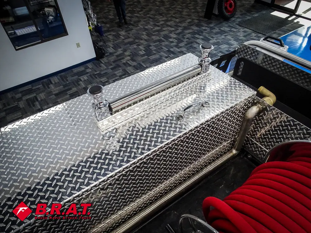 Long top-side tray compartment above hose reel.