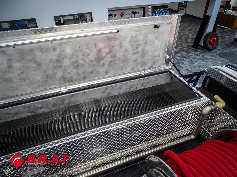 Top storage compartment interior with lid raised.