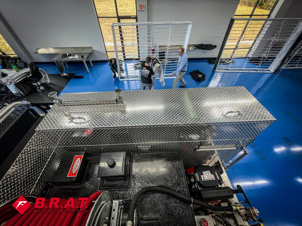 Rear deck with pump and controls visible below.