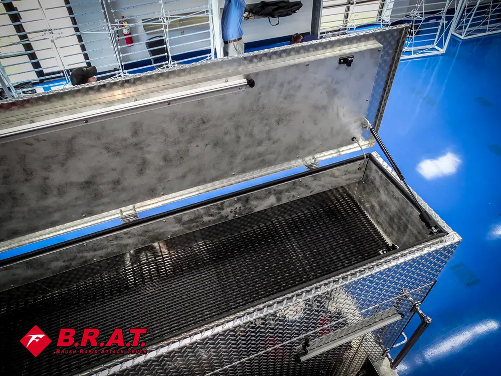 Deep top box compartment with black interior surface.