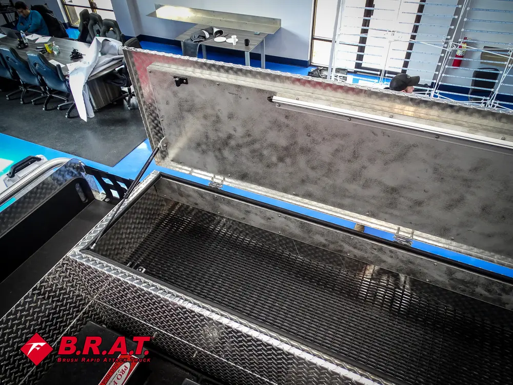 Open top compartment from opposite side with lid strut visible.