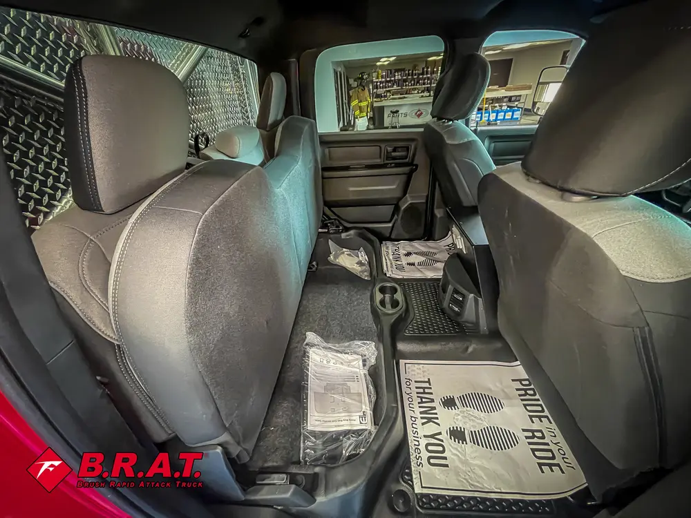 Rear seat legroom view from open rear door.