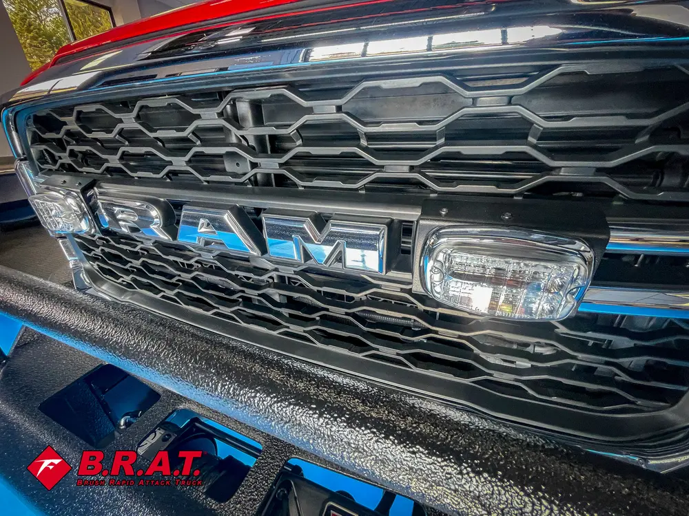 Close-up of front grille with integrated warning lights.