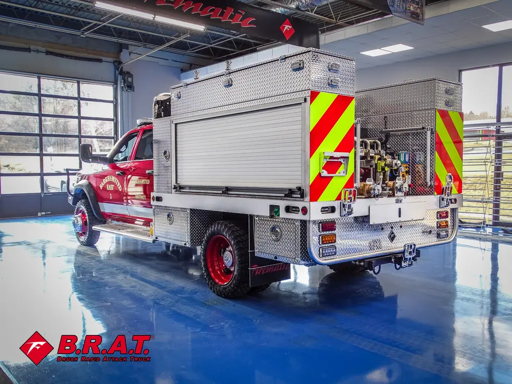 Rear driver-side three-quarter garage view with folded step ladder.