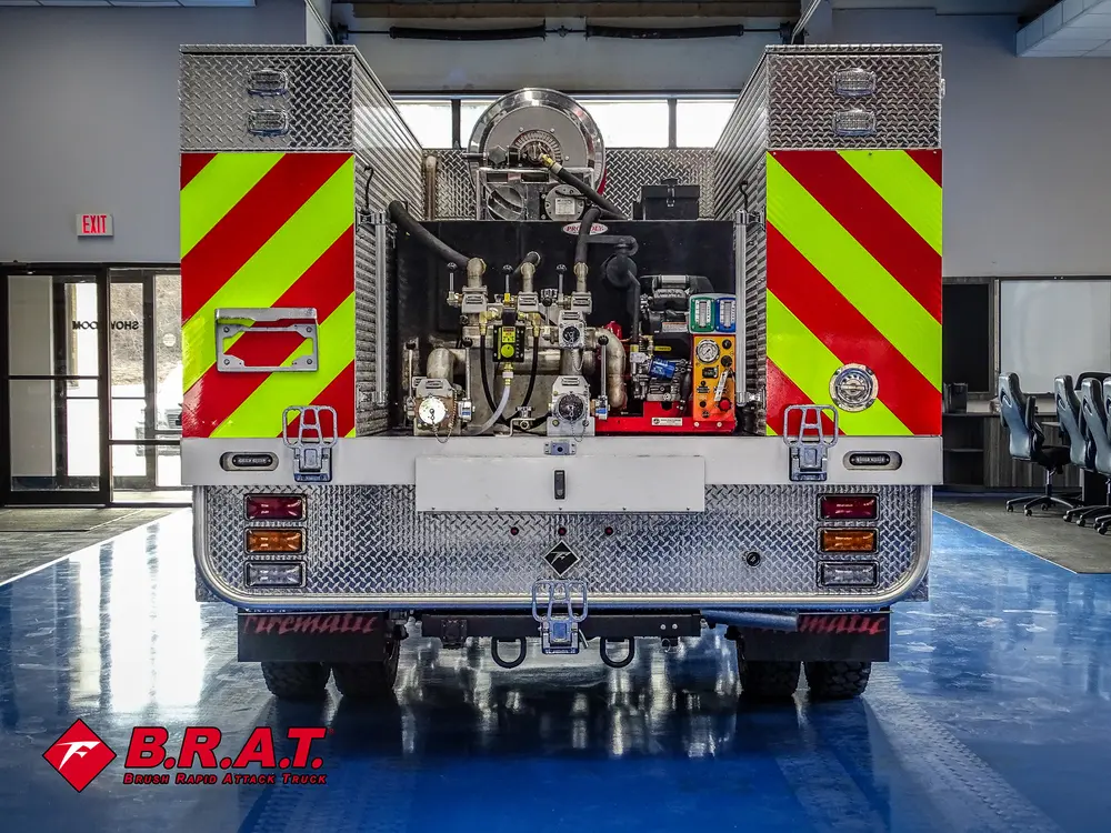 Straight rear view with open pump bay and chevron rear doors.