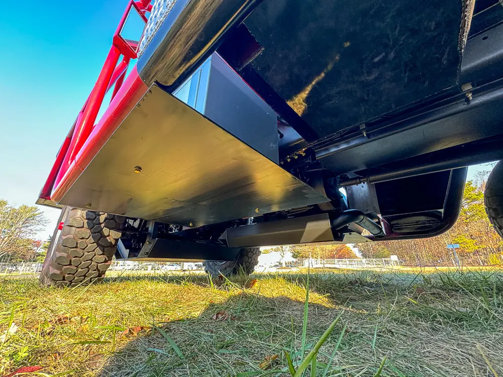 Underside side-angle view with frame and suspension components.